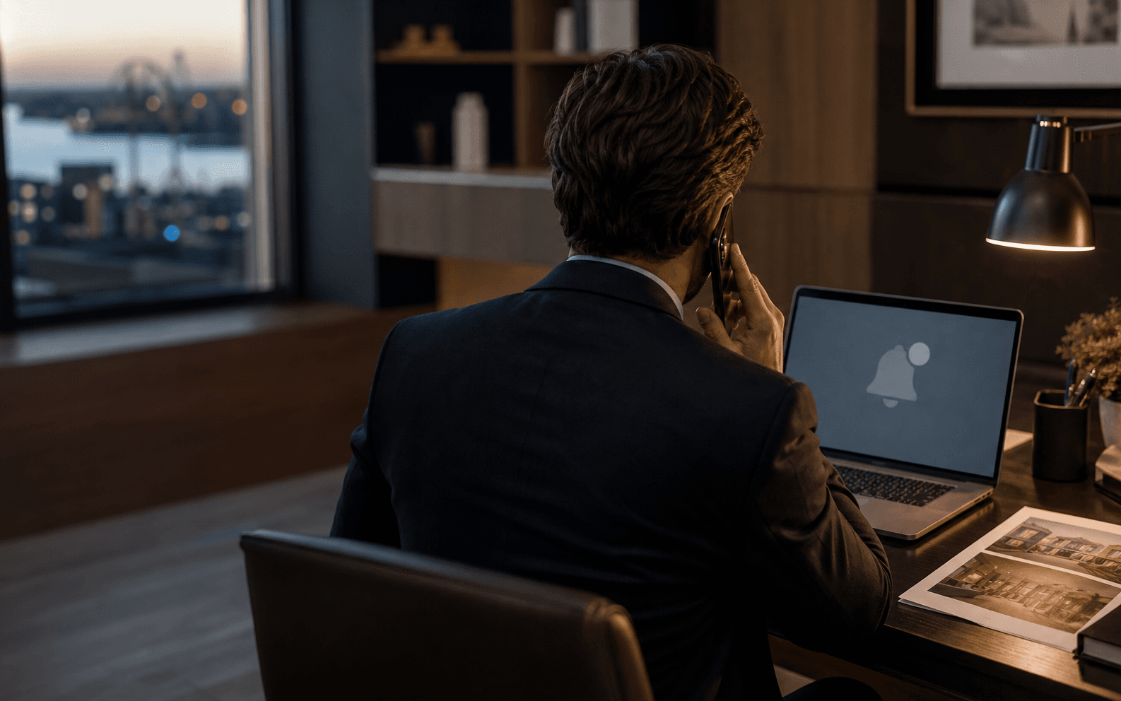 A real estate broker calling a client after a laptop reminder.